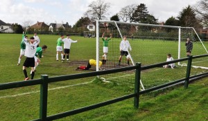 Stephen Dickinson opens the scoring for the Alumni. Pic by Roisin Brehony